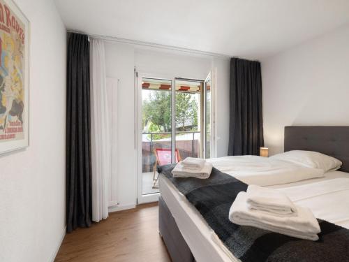 Ένα ή περισσότερα κρεβάτια σε δωμάτιο στο Apartment Allod Park Haus C 105 by Interhome