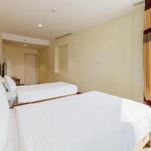 a room with two beds in a room at Dancenter Near Hoan Kiem Lake, Vincom Center Ba Trieu Formerly Le Grand The Sun in Hanoi