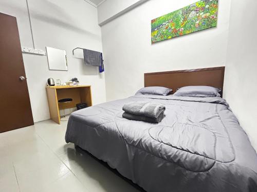 Кровать или кровати в номере MDF Payang Guest House