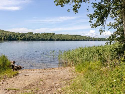a view of a body of water with trees at Holiday Home Sjödrömmen by Interhome in Näsviken
