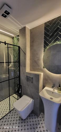 a bathroom with a sink and a toilet at Fuego in Rowy