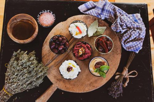 a wooden cutting board topped with different types of food at Silenza B&B, Charme, Comfort e Relax nel Gargano in Mattinata