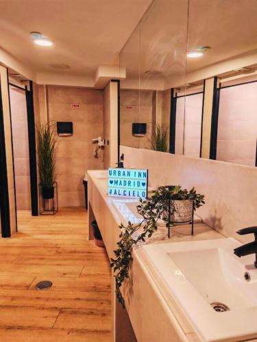 a bathroom with a sink and a sign that says when im avoiding anxiety at Capsule Inn Madrid in Madrid
