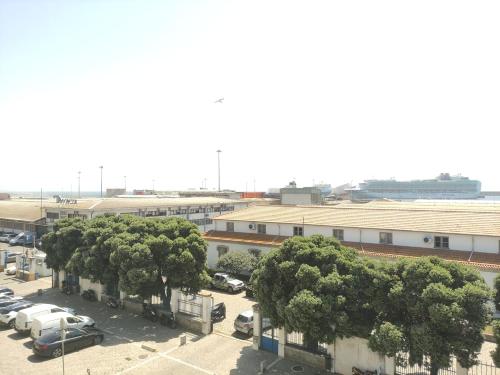 an overhead view of a parking lot with trees and buildings at SOL & SAL T2 Matosinhos in Matosinhos