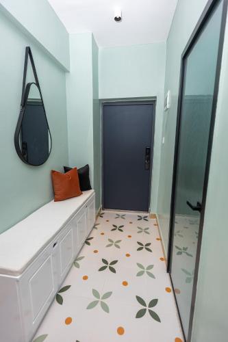 a dressing room with a bench and a mirror at TheEJResidence- 2Bedroom All Ensuite- 7km from JKIA 3km from SGR and Expressway along Mombasa Road-Nairobi Kenya in Nairobi