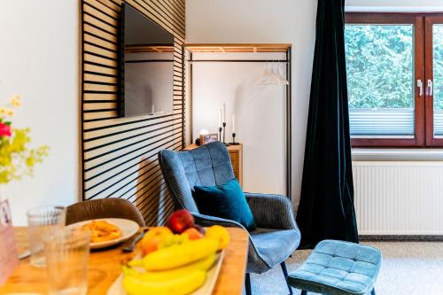 a dining room with a table with bananas on it at S17 Bude 8 Studio in Flensburg