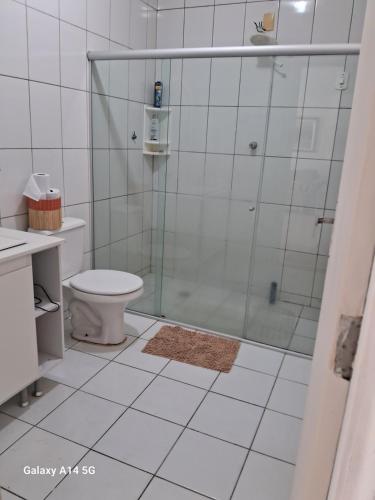 a bathroom with a shower and a toilet at Aconchego do sertão in Petrolina