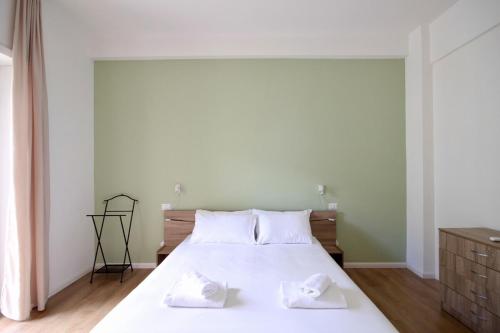 a bedroom with a large white bed with two white pillows at HC - Charming Apartment in Vigna Clara in Rome