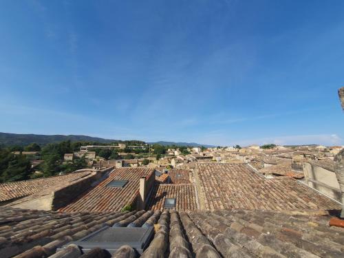 an aerial view of a city with roofs at Maison Grand Rue - Vue Exceptionnelle sur le Luberon in Lauris