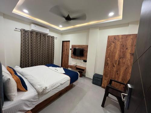 En eller flere senge i et værelse på Hotel MD Star