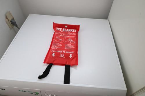 a red bag sitting on top of a washing machine at Kritharistra Home in Vlakhiá