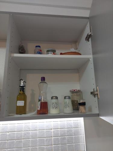 a drawer of a refrigerator with bottles and jars at Kritharistra Home in Vlakhiá