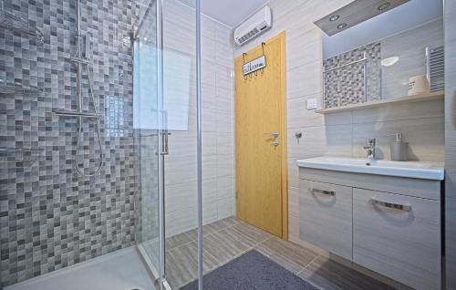a bathroom with a glass shower and a sink at Holiday House Lucija by Villas Guide in Ozalj