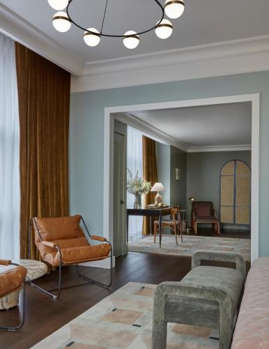 a living room with a couch and chairs and a table at Citizen House Hotel in Oklahoma City