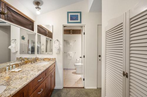 a bathroom with two sinks and a toilet at Wailea Elua 808 - Scenic Ocean Views, Classic Wailea Charm, Central AC, Wi-Fi in Wailea
