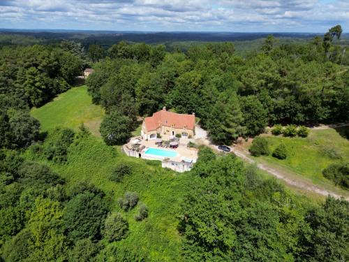 an overhead view of a large house with a swimming pool at Luxury Chateau w. pool & hot tub in Dordogne in Cazenac