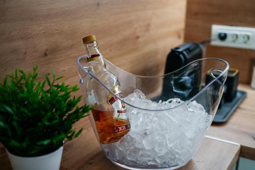 a bottle of beer sitting in a bucket of ice at Hedera Sovata 2 in Sovata