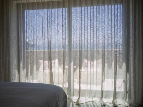 Postel nebo postele na pokoji v ubytování VEZO Suites Mykonos