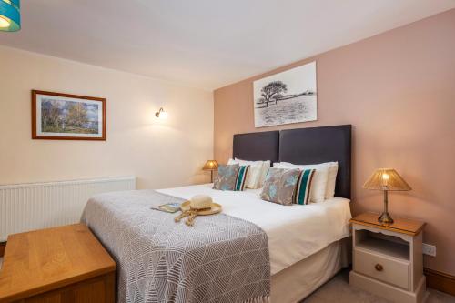 a bedroom with a bed with a teddy bear on it at Wheal Kitty nr Truro in Truro