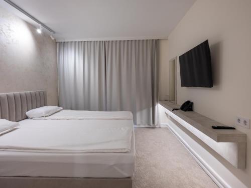 Postel nebo postele na pokoji v ubytování Grand Hotel & Therme Veliko Tarnovo