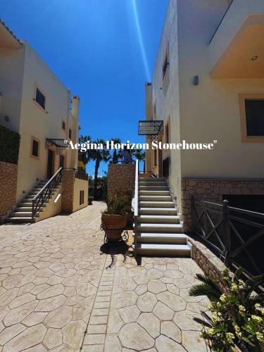 a building with a staircase and a stair case at Aegina Horizon Stonehouse No I in Aegina