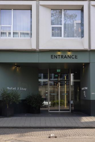 an entrance to a building with an entrance sign at Hotel2Stay in Amsterdam