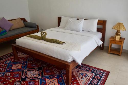 Ένα ή περισσότερα κρεβάτια σε δωμάτιο στο Makati Villa Tulamben