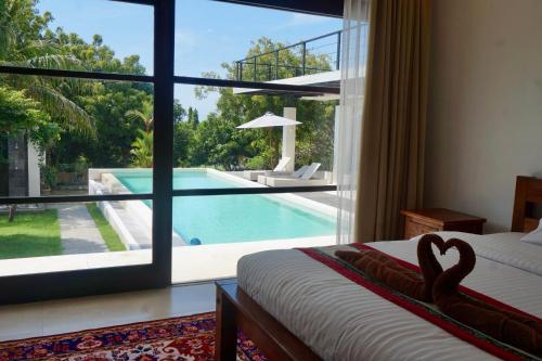 Πισίνα στο ή κοντά στο Makati Villa Tulamben