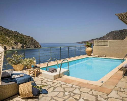 a swimming pool with a view of the ocean at Magnificent Kefalonia Villa Villa Chalker 3 Bedrooms Seafornt Spectacular Sea Views Private Outdoor Pool Assos in Asos