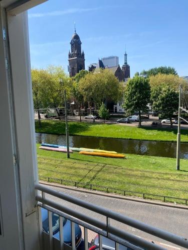 a view of a park from a window at Cozy and best location! 6 person in Rotterdam