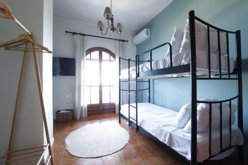 a bedroom with two bunk beds and a window at The Summit Escape House in Achílleion