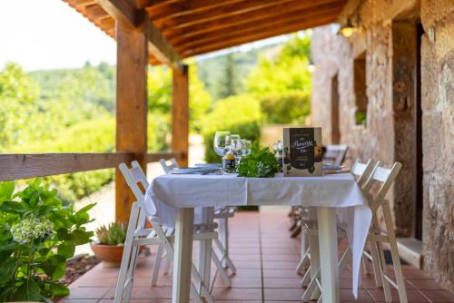 a white table and chairs on a patio at Quinta de Silvares in Armamar