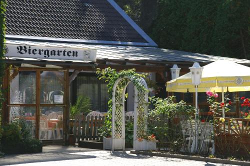 a store with a sign in front of it at Hotel Restaurant Bieberstuben in Menden