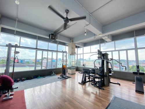 an empty gym with a view of the city at Alltrue Sydney Hotel Batam Center in Batam Center