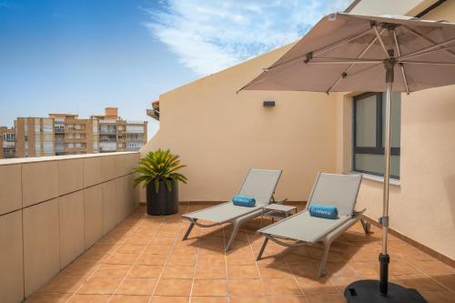 Uma varanda ou terraço em Occidental Granada