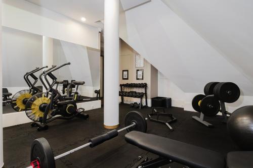 a gym with several exercise bikes in a room at Craft Beer Central Hotel in Gdańsk