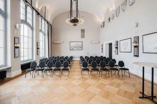 an empty room with chairs and tables in it at Craft Beer Central Hotel in Gdańsk