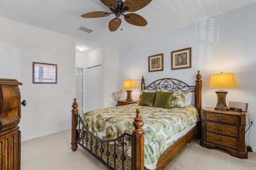 a bedroom with a bed and a ceiling fan at Peaceful and Relaxing Community - Peace of Cape - Roelens in Cape Coral