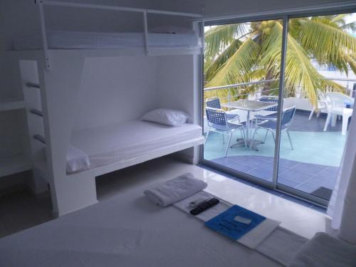 Krevet ili kreveti na sprat u jedinici u okviru objekta Hotel Portoalegre