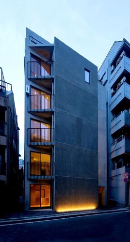 a building with balconies on the side of it at NESTo KAMATA in Tokyo