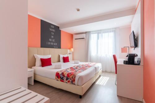a hotel room with a bed and a tv at THE Hotel MASA Almirante LISBON Stylish in Lisbon