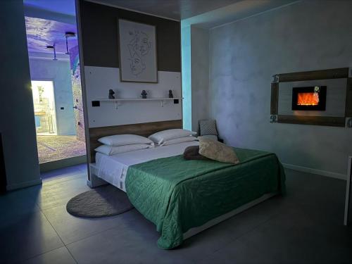 Ένα ή περισσότερα κρεβάτια σε δωμάτιο στο B&B Palazzo del Toro