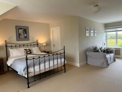 a bedroom with a bed and a window at Grianán in Ballyconneely
