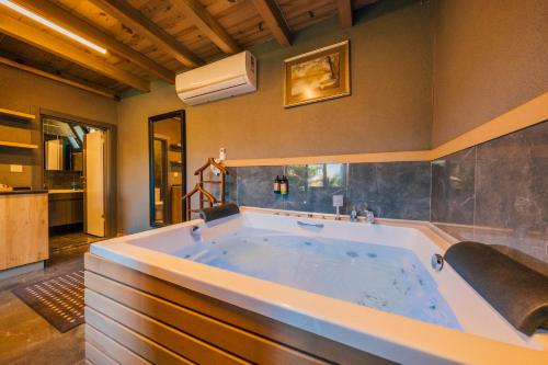a large bathroom with a large bath tub at antik river house in Sile