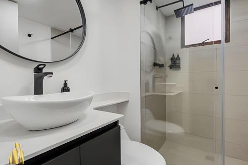 a white bathroom with a sink and a shower at Ankara 302 - Clean Comfy Loft Trendy in Provenza in El Poblado