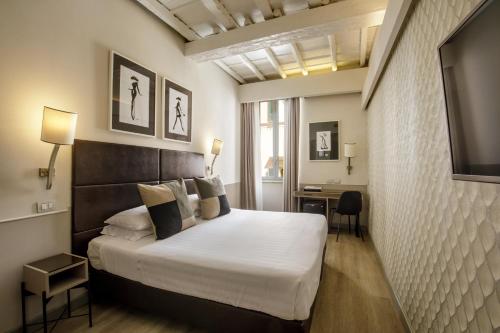 Posteľ alebo postele v izbe v ubytovaní Condotti Palace