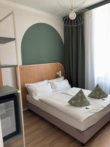 a bedroom with a bed and a television in it at Gästehaus Centro in Konstanz in Konstanz