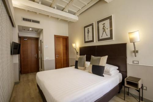 Posteľ alebo postele v izbe v ubytovaní Condotti Palace