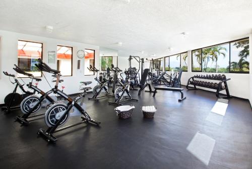 a gym with several exercise bikes in a room at Samba Vallarta All Inclusive in Nuevo Vallarta 
