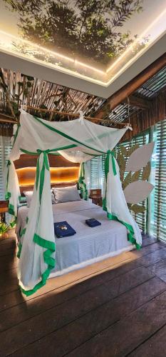 Postel nebo postele na pokoji v ubytování Casa del arbol Balcón del Tacana